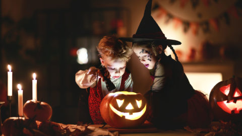 Happy,Children,In,Costumes,Of,Witch,And,Vampire,In,A