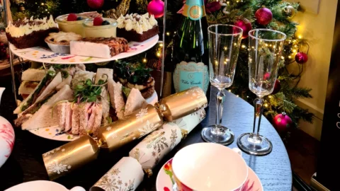 A table with food and glasses on it.